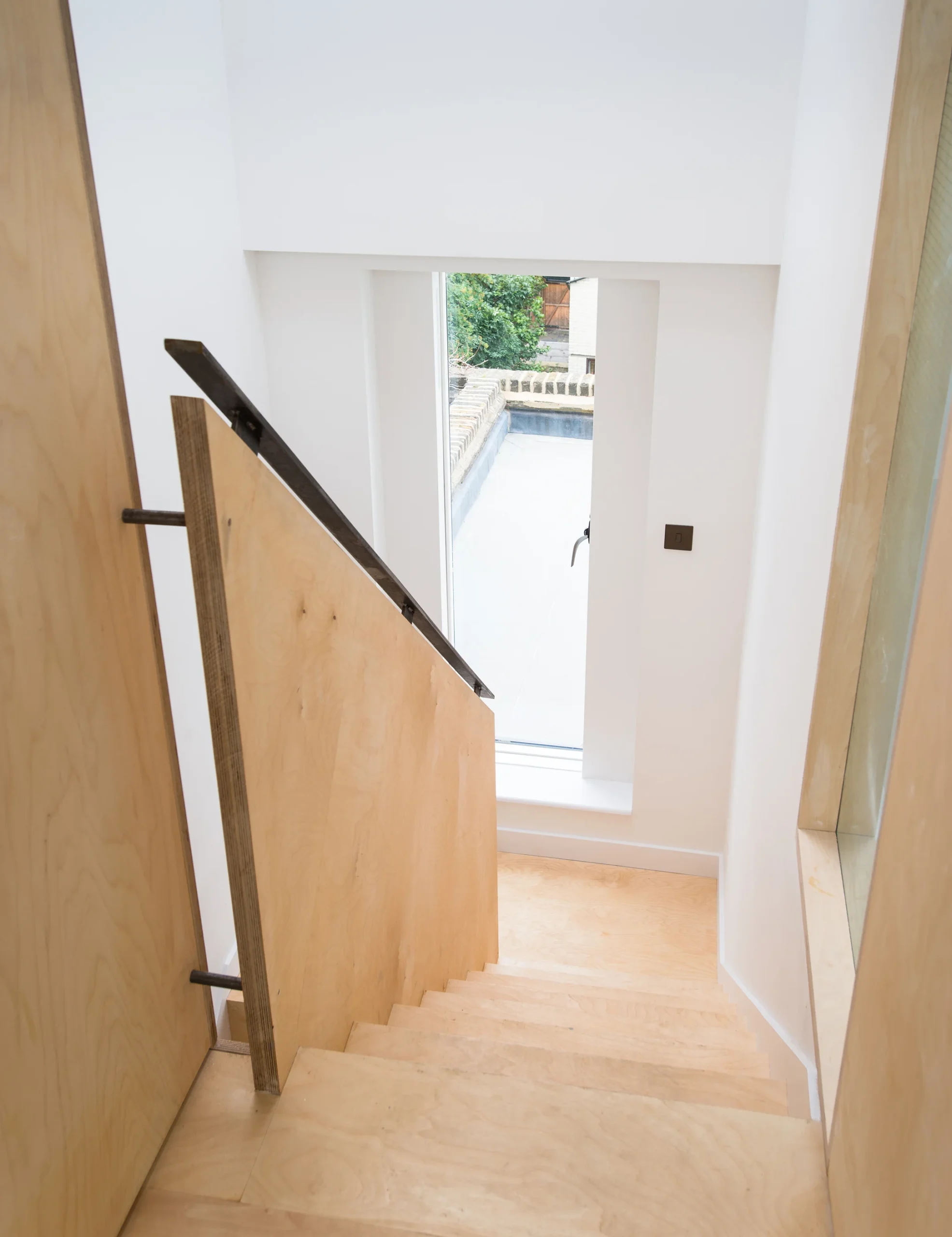 Camden_10_2160px Pale birch plywood staircase lined in timber rising to the loft