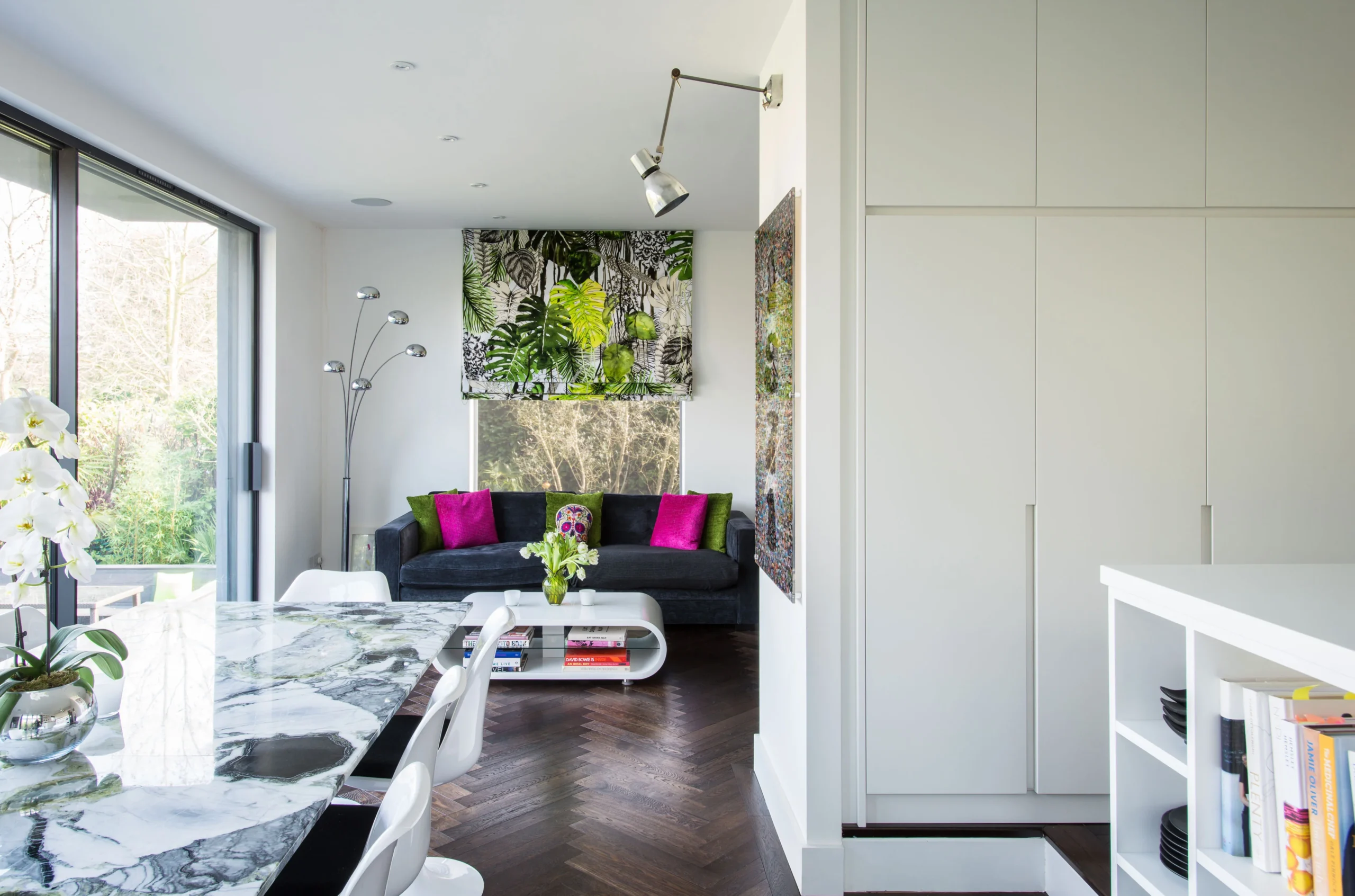 Open-plan kitchen, dining and sitting area in the rear extension with sliding doors to the garden