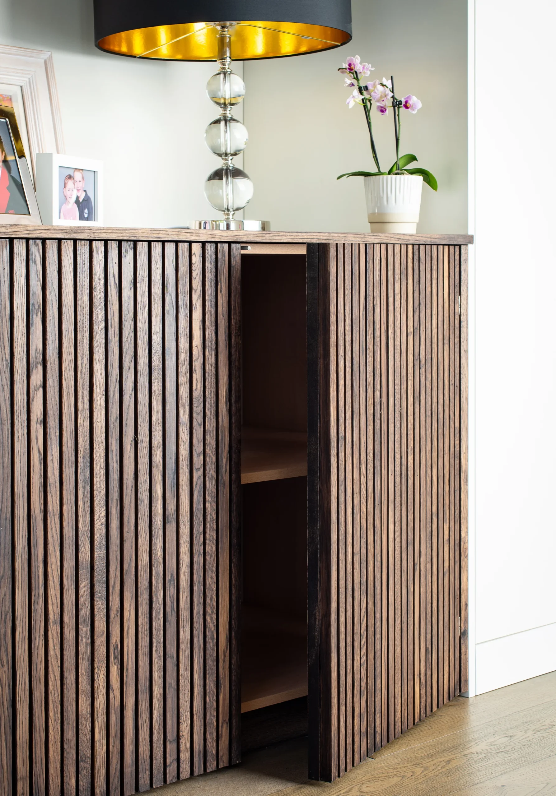 Hafer-Rd_2160px_11 Oak-slatted cabinet with concealed door opening onto storage shelves