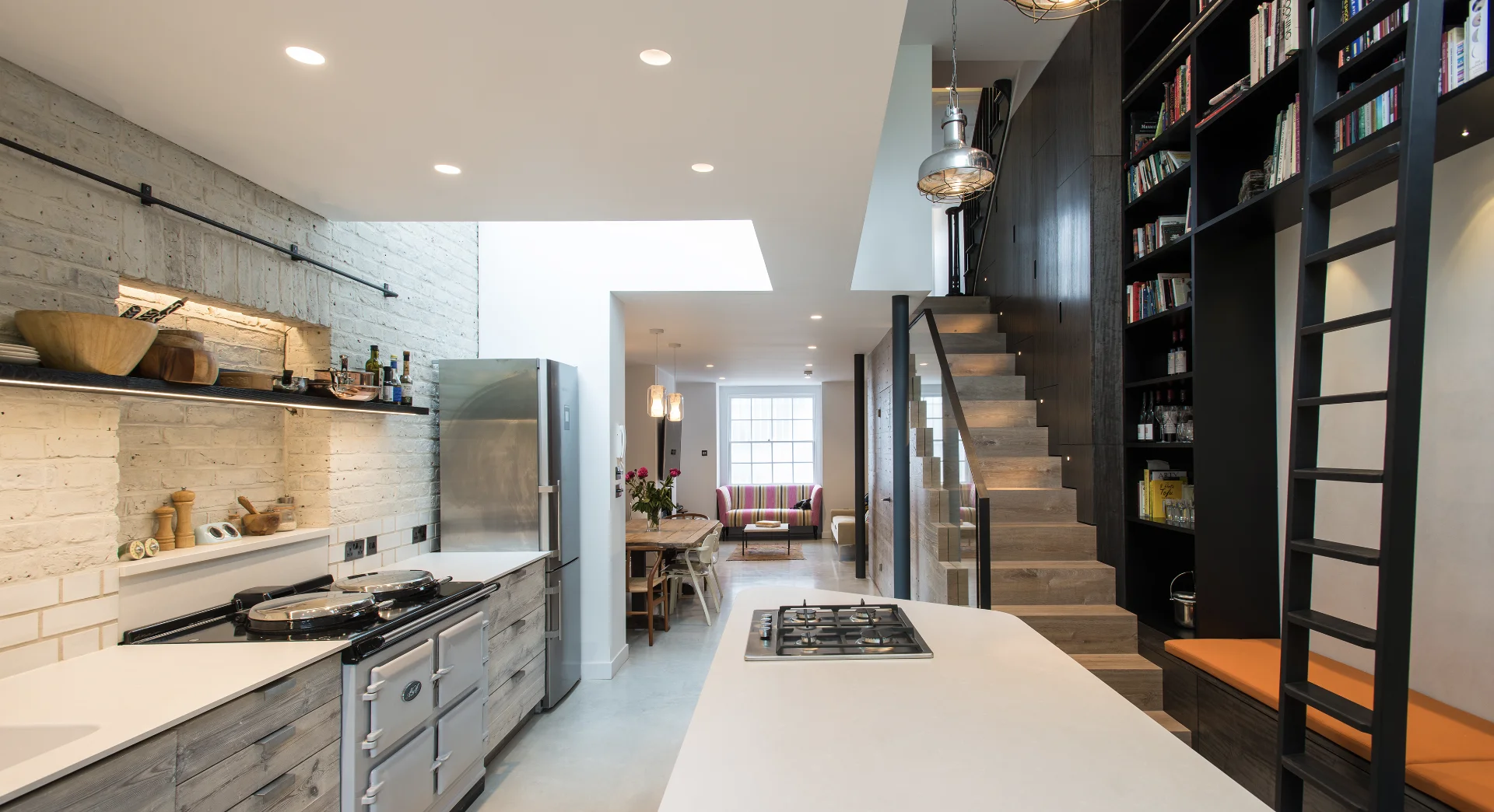 Open-plan kitchen, lounge and dining space with bespoke staircase in Notting Hill, London